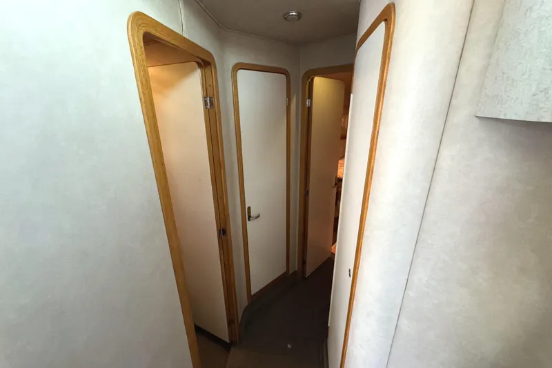 Lady Slipper Yacht Photos Pics Interior hallway of 1996 Sea Ray 400 Sedan Bridge yacht with wooden door frames.