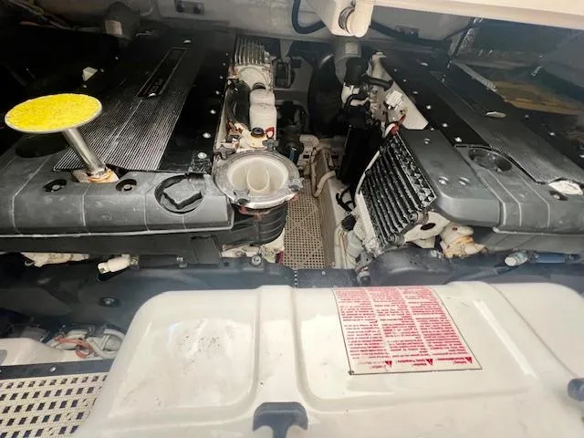  Yacht Photos Pics Engine compartment of a 2007 Tiara Yachts 3900 Sovran, showcasing dual engines and mechanical components.