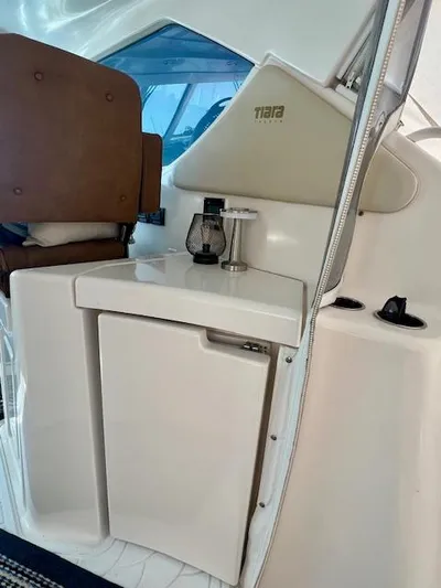  Yacht Photos Pics 2007 Tiara Yachts 3900 Sovran interior with seating and compact kitchenette.