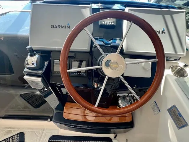  Yacht Photos Pics 2007 Tiara Yachts 3900 Sovran helm with Garmin navigation and wooden steering wheel.