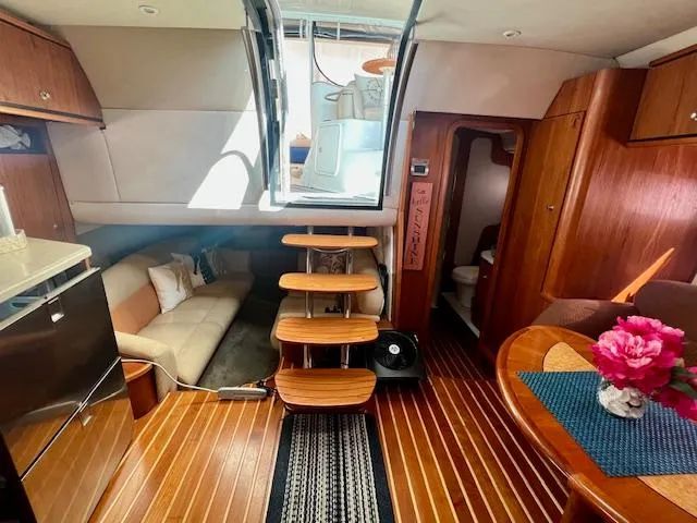  Yacht Photos Pics 2007 Tiara Yachts 3900 Sovran interior with wooden flooring, cozy seating, and elegant decor.