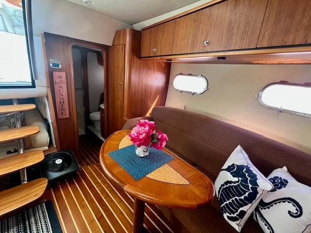  Yacht Photos Pics 2007 Tiara Yachts 3900 Sovran interior with wooden cabinetry, cozy seating, and decorative accents.