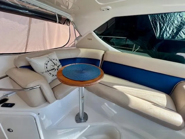  Yacht Photos Pics 2007 Tiara Yachts 3900 Sovran interior with cushioned seating and a small table.
