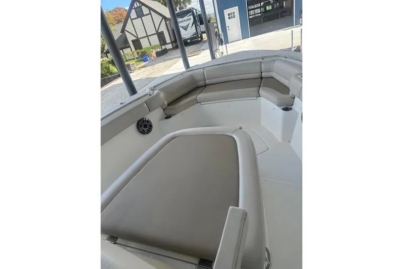  Yacht Photos Pics 2016 Boston Whaler 330 Outrage boat interior with cushioned seating and modern design.