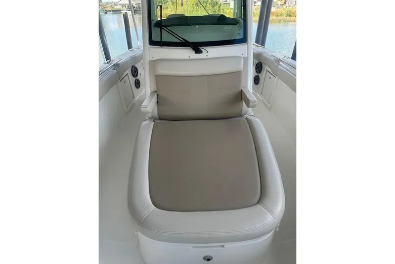  Yacht Photos Pics 2016 Boston Whaler 330 Outrage boat interior with cushioned seating and armrests.