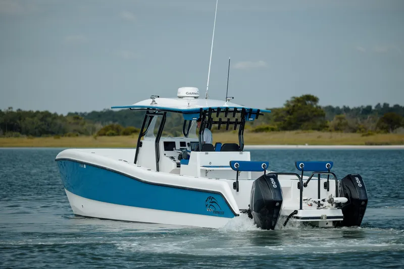  Yacht Photos Pics 2020 Prowler 31 boat with dual engines cruising on a calm lake.