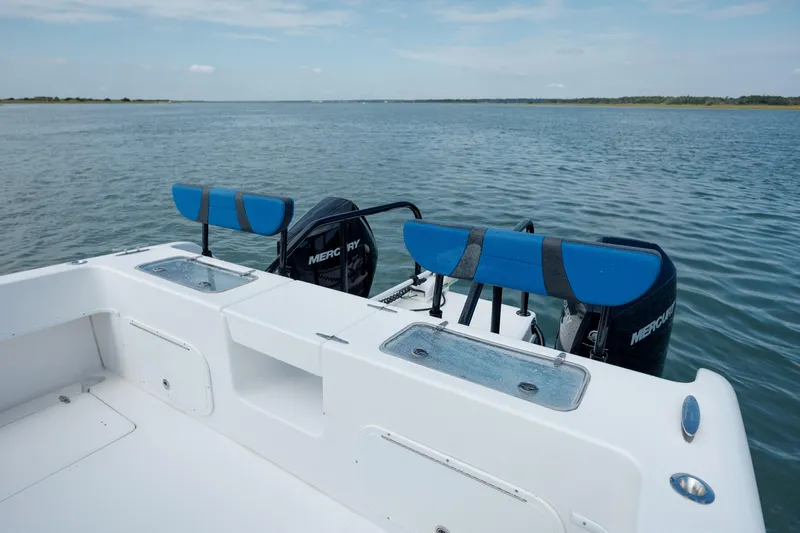  Yacht Photos Pics 2020 Prowler 31 boat with dual Mercury engines on a calm lake.