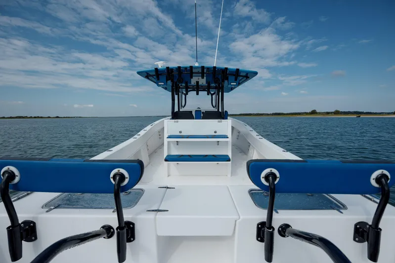  Yacht Photos Pics 2020 Prowler 31 boat on calm water under a blue sky.