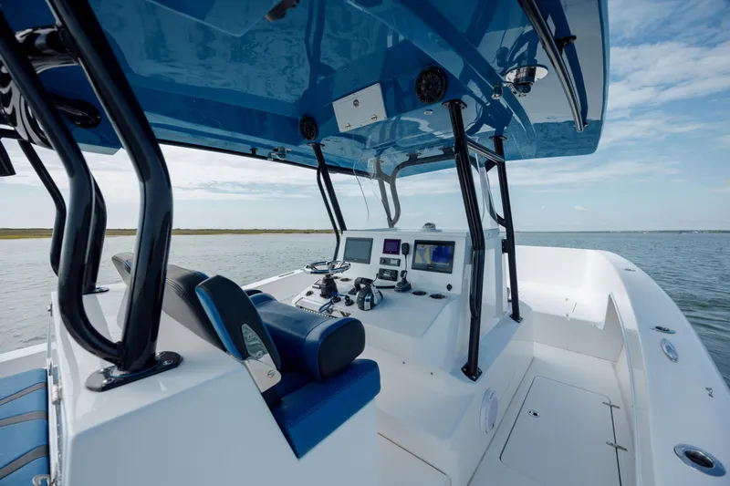  Yacht Photos Pics 2020 Prowler 31 boat interior with modern controls and blue accents on open water.