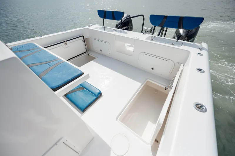  Yacht Photos Pics 2020 Prowler 31 boat deck with blue seating and storage compartments.