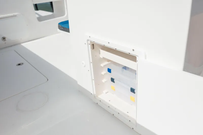  Yacht Photos Pics 2020 Prowler 31 boat storage compartment with tackle boxes.