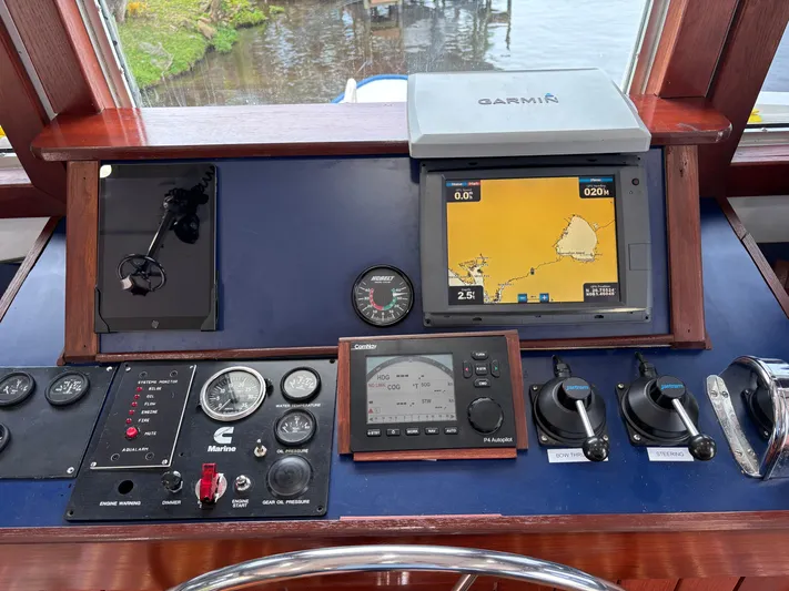 Restless T Yacht Photos Pics 1971 Sermons Expedition boat dashboard with navigation equipment and controls.