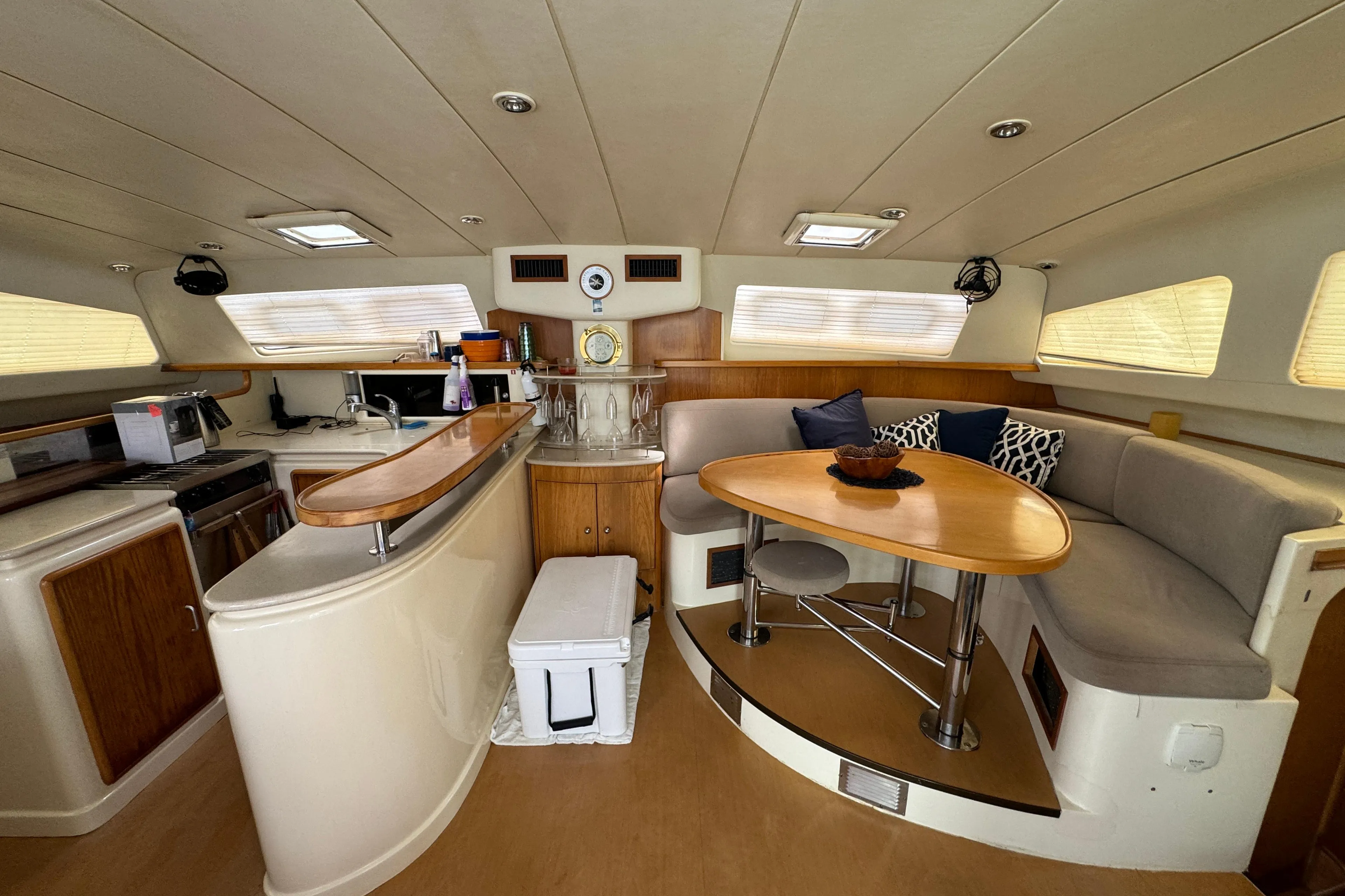 Spacious interior of 2003 Leopard 47 yacht with modern kitchen and dining area.