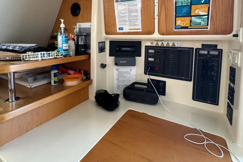 U Turn Yacht Photos Pics Navigation station on a 2003 Leopard 47 catamaran with control panels and storage.