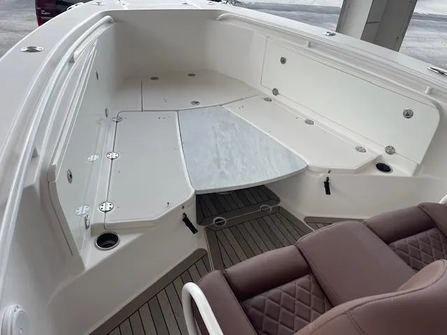  Yacht Photos Pics 2014 Everglades 325 Center Console boat interior with seating and storage compartments.