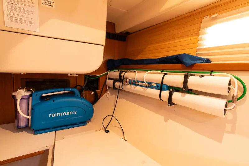 Age Gap Yacht Photos Pics Water filtration system inside 2023 Catalina 425 yacht cabin.