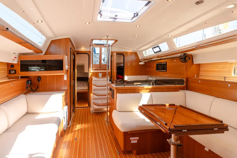 Age Gap Yacht Photos Pics Luxurious interior of 2023 Catalina 425 yacht with wood finish and modern amenities.