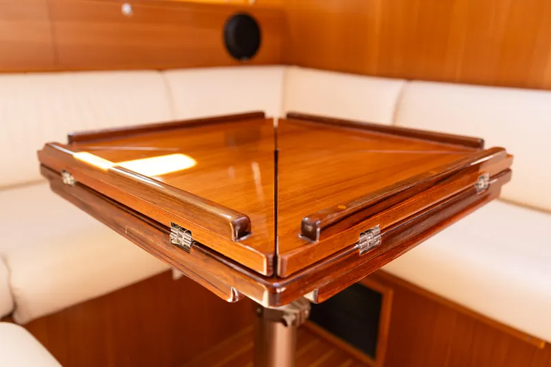 Age Gap Yacht Photos Pics Elegant wooden table in a 2023 Catalina 425 yacht interior.