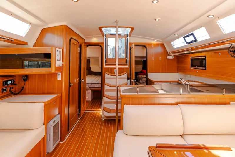 Age Gap Yacht Photos Pics Interior of 2023 Catalina 425 yacht with modern wood finish and spacious layout.