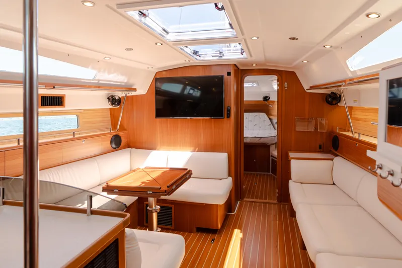 Age Gap Yacht Photos Pics Luxurious interior of 2023 Catalina 425 yacht with modern amenities and elegant wood finish.