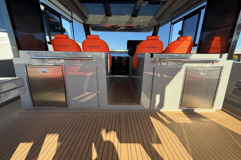  Yacht Photos Pics 2024 De Antonio Yachts D50 interior with orange seats and sleek design.