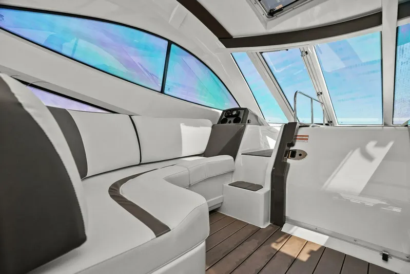Shoes Knot Allowed Yacht Photos Pics Luxurious interior of 2014 Cruisers Yachts 540 Sports Coupe with sleek seating and panoramic windows.