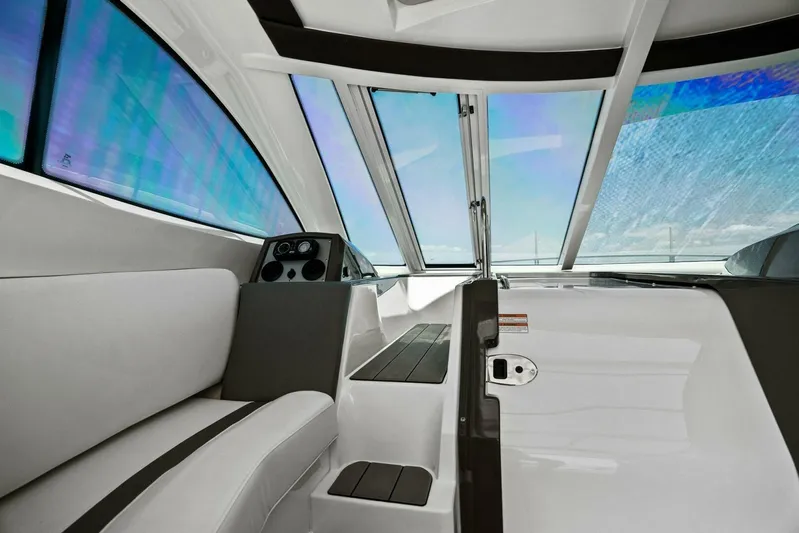 Shoes Knot Allowed Yacht Photos Pics 2014 Cruisers Yachts 540 Sports Coupe interior with sleek design and panoramic windows.