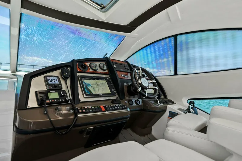 Shoes Knot Allowed Yacht Photos Pics 2014 Cruisers Yachts 540 Sports Coupe helm with advanced navigation systems and luxurious seating.