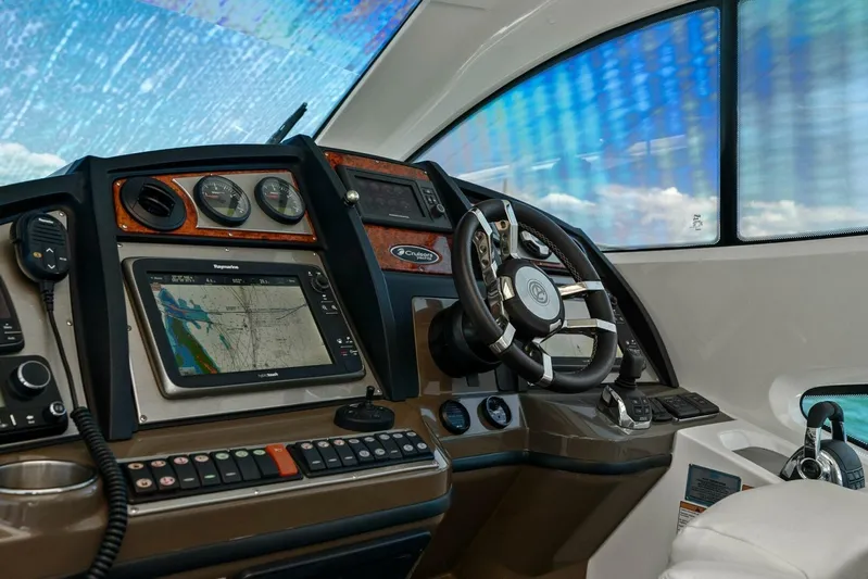 Shoes Knot Allowed Yacht Photos Pics 2014 Cruisers Yachts 540 Sports Coupe helm with navigation system and controls.