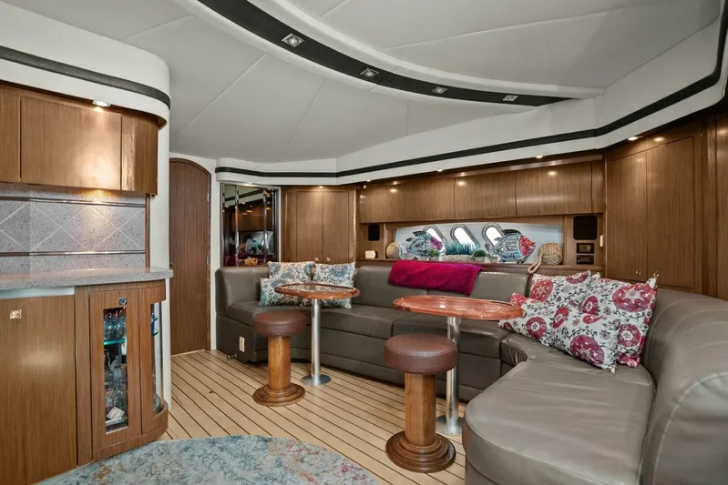 Shoes Knot Allowed Yacht Photos Pics Luxurious interior of 2014 Cruisers Yachts 540 Sports Coupe with elegant seating and wooden finishes.