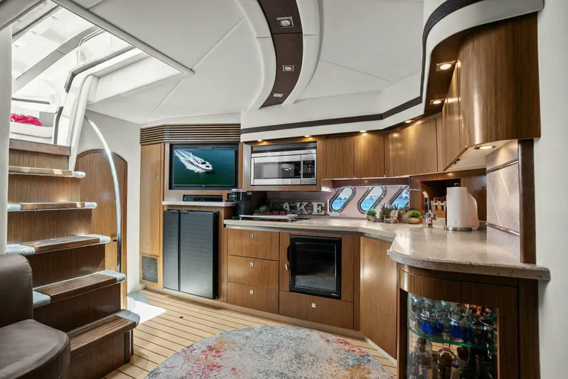 Shoes Knot Allowed Yacht Photos Pics Luxurious interior of 2014 Cruisers Yachts 540 Sports Coupe with modern kitchen and elegant design.