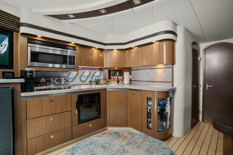 Shoes Knot Allowed Yacht Photos Pics Luxurious kitchen interior of 2014 Cruisers Yachts 540 Sports Coupe with modern appliances.