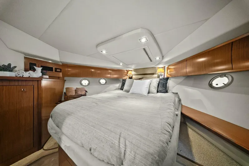 Shoes Knot Allowed Yacht Photos Pics Luxurious cabin interior of 2014 Cruisers Yachts 540 Sports Coupe with elegant wood finishes.