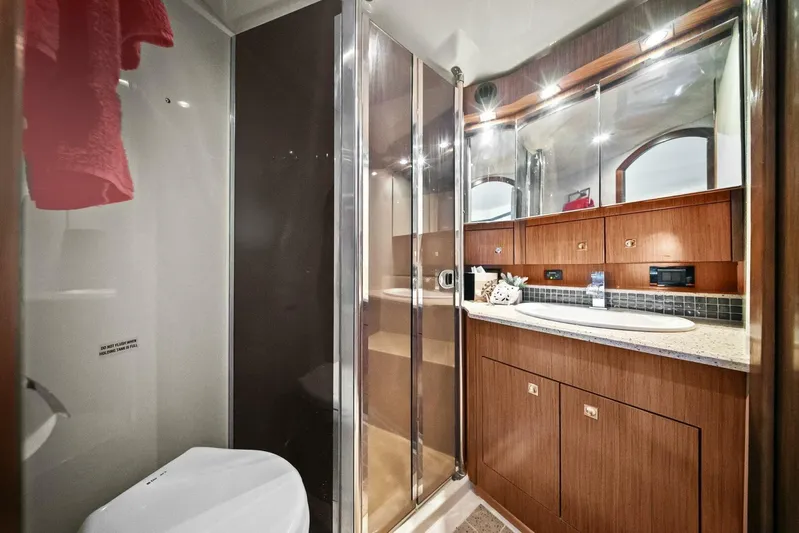 Shoes Knot Allowed Yacht Photos Pics Luxurious bathroom in 2014 Cruisers Yachts 540 Sports Coupe with modern fixtures and wood cabinetry.