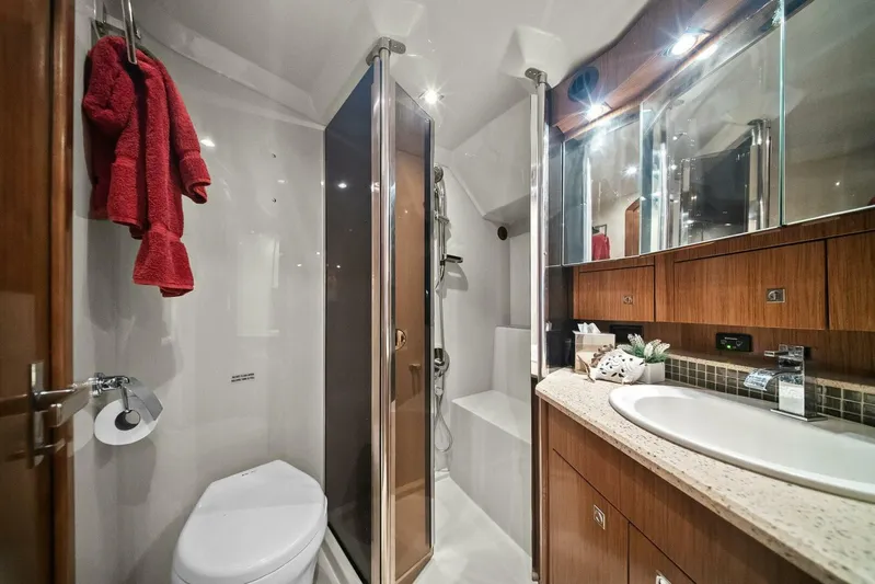 Shoes Knot Allowed Yacht Photos Pics Luxurious bathroom in 2014 Cruisers Yachts 540 Sports Coupe with modern fixtures and wooden cabinetry.