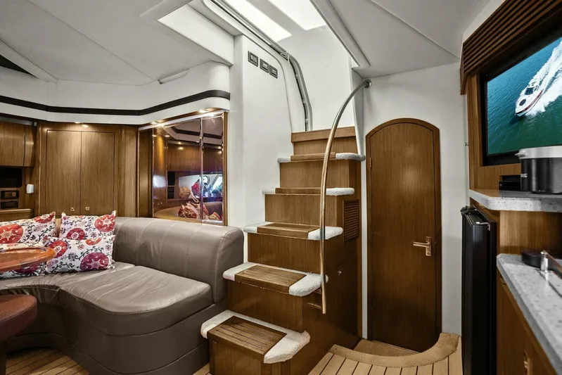 Shoes Knot Allowed Yacht Photos Pics Luxurious interior of 2014 Cruisers Yachts 540 Sports Coupe with elegant wood finishes.