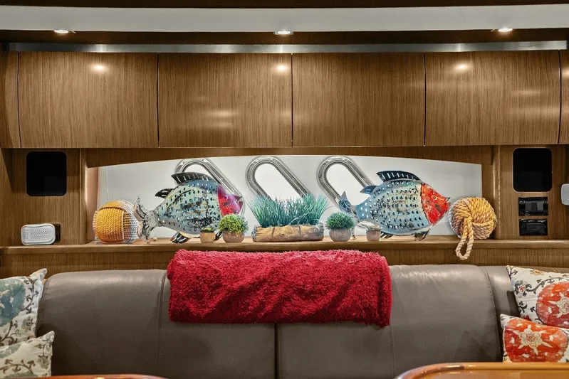 Shoes Knot Allowed Yacht Photos Pics Luxurious 2014 Cruisers Yachts 540 Sports Coupe interior with decorative fish and cozy accents.