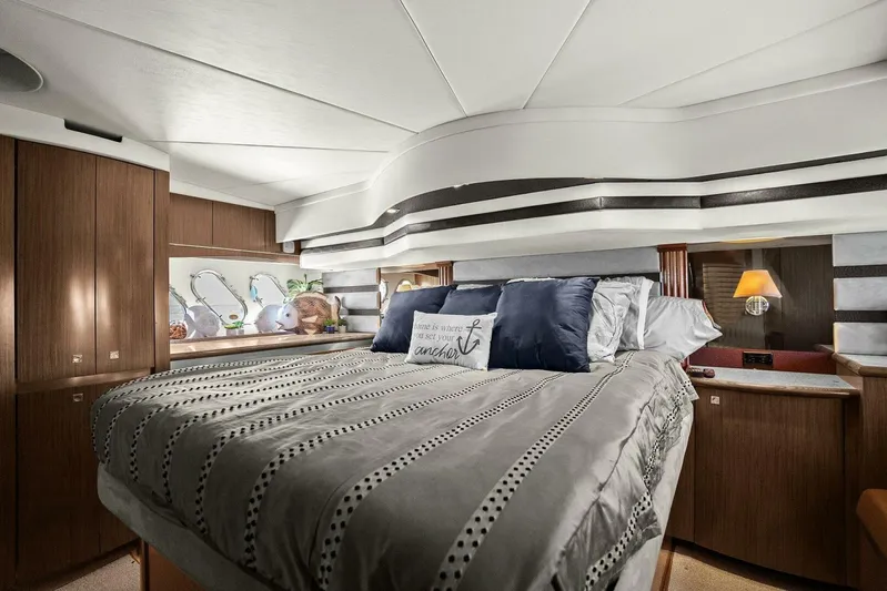 Shoes Knot Allowed Yacht Photos Pics Luxurious bedroom interior of 2014 Cruisers Yachts 540 Sports Coupe with elegant bedding and decor.