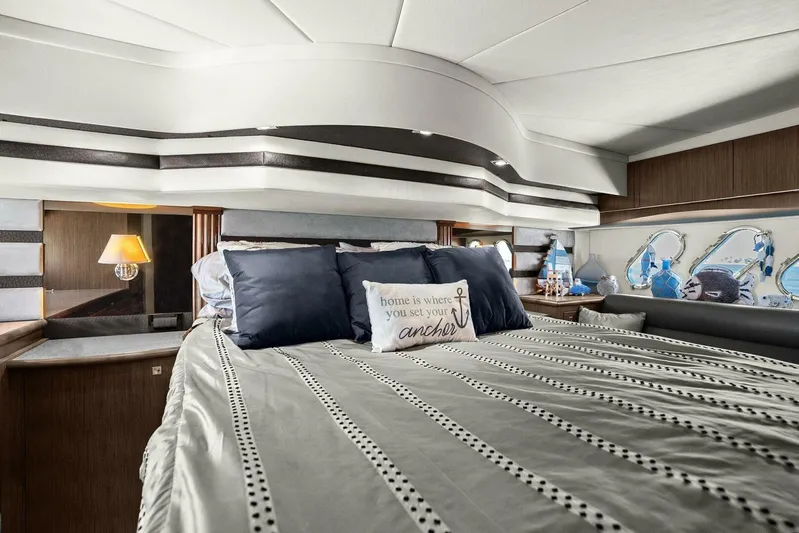 Shoes Knot Allowed Yacht Photos Pics Luxurious bedroom interior of 2014 Cruisers Yachts 540 Sports Coupe with nautical decor.