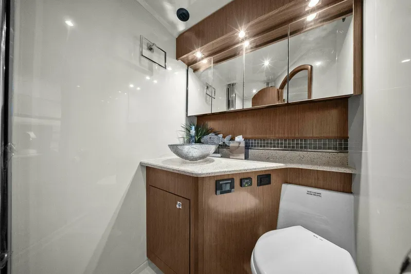 Shoes Knot Allowed Yacht Photos Pics Luxurious bathroom in 2014 Cruisers Yachts 540 Sports Coupe with modern fixtures and wood accents.