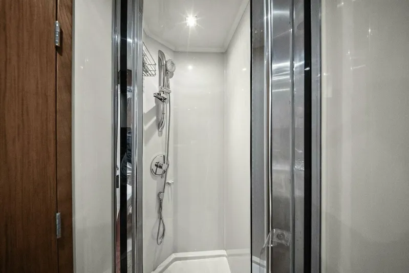 Shoes Knot Allowed Yacht Photos Pics Shower area in 2014 Cruisers Yachts 540 Sports Coupe, featuring sleek modern design.