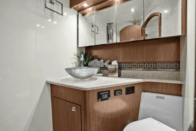 Shoes Knot Allowed Yacht Photos Pics Luxurious bathroom in 2014 Cruisers Yachts 540 Sports Coupe with modern fixtures and elegant design.