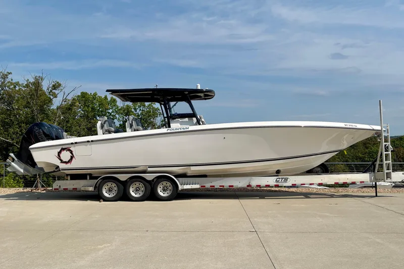  Yacht Photos Pics 2022 Fountain 38 SC boat on trailer, side view, outdoors.