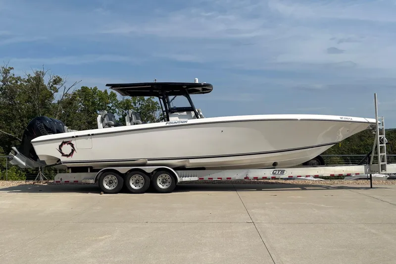  Yacht Photos Pics 2022 Fountain 38 SC boat on trailer, side view, outdoors.
