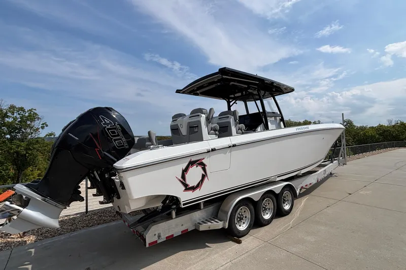  Yacht Photos Pics 2022 Fountain 38 SC boat on trailer with powerful outboard engine.