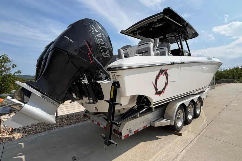  Yacht Photos Pics 2022 Fountain 38 SC boat on trailer with powerful outboard engine.