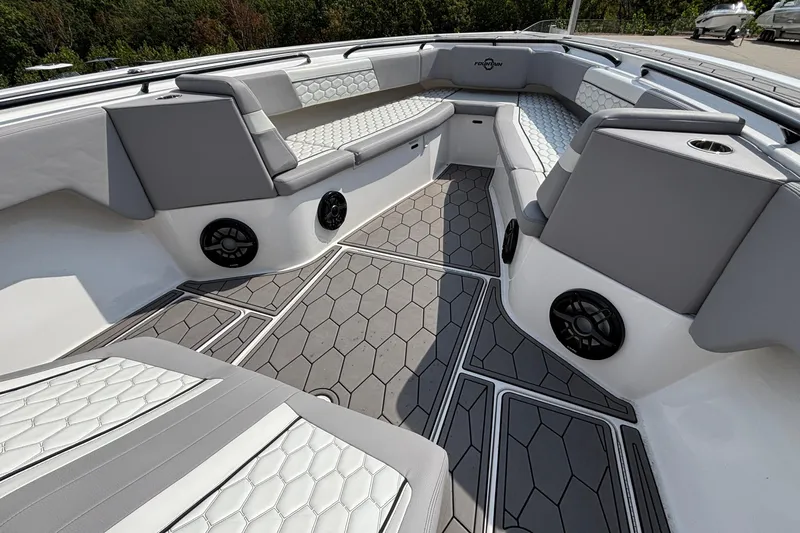  Yacht Photos Pics Luxurious interior of 2022 Fountain 38 SC boat with stylish seating and speakers.