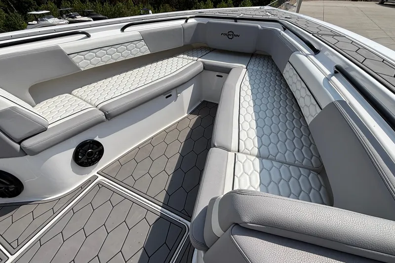  Yacht Photos Pics Luxurious seating area on a 2022 Fountain 38 SC boat with hexagonal pattern upholstery.