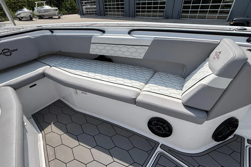  Yacht Photos Pics 2022 Fountain 38 SC boat interior with gray seating and hexagonal pattern flooring.