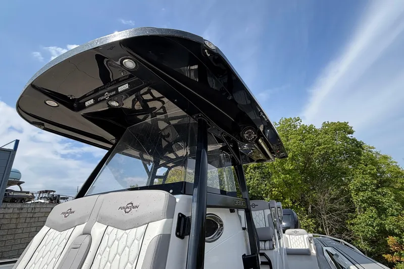  Yacht Photos Pics 2022 Fountain 38 SC boat with sleek design and modern features, under a clear sky.